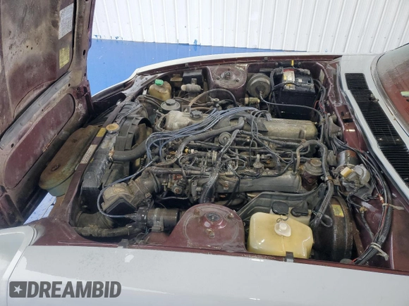 1982 Datsun 280ZX z VIN JN1HZ04S5CX431646, wystawiony jako Copart lot #55607255 z przebiegiem 173 546 mil mil oraz Tytuł czysty. Historia ofert i sprzedaży dostępna na DreamBid. Obrazek 11.