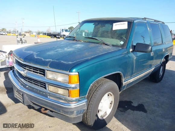1997 Chevrolet Tahoe with VIN 1GNEK13RXVJ375189, listed as a IAAI auction lot 41959601 with 153,589 mi miles. Bid and sale history available at carsss.com. Image 2.