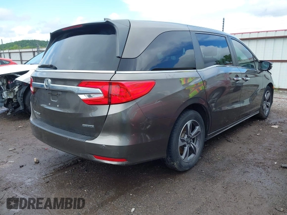 2019 Honda Odyssey Touring with VIN 5FNRL6H81KB038790, listed as a IAAI auction lot 42200190 with 131,761 mi miles and . Bid and sale history available at DreamBid. Image 4.