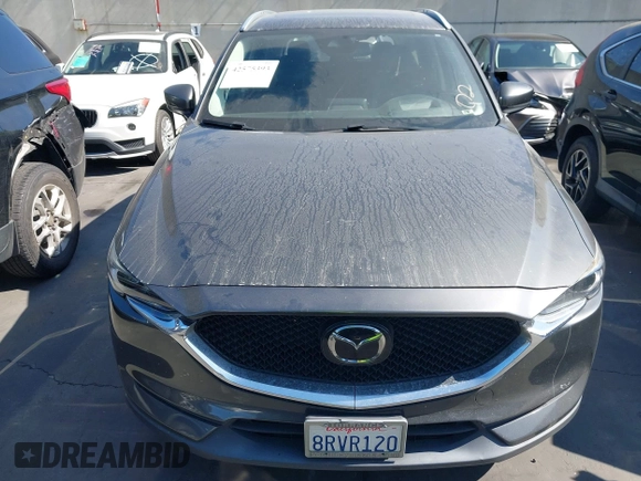 2020 Mazda CX-5 Grand Touring with VIN JM3KFADM3L1812649, listed as a IAAI auction lot 42575393 with 102,118 mi miles and . Bid and sale history available at DreamBid. Image 13.