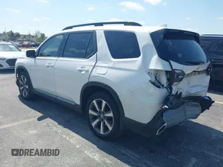 2024 Honda Pilot Touring z VIN 5FNYG2H72RB016937, wystawiony jako IAAI lot #42137854 z przebiegiem 18 028 mil mil oraz . Historia ofert i sprzedaży dostępna na DreamBid. Obrazek 3.