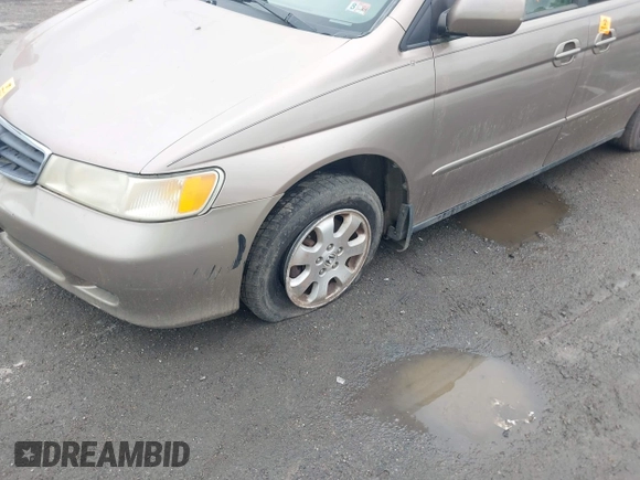 2003 Honda Odyssey EX-L with VIN 5FNRL180X3B151488, listed as a IAAI auction lot 42681426 with 231,065 mi miles and . Bid and sale history available at DreamBid. Image 6.