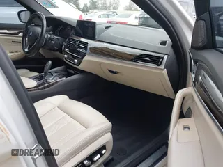 2018 BMW 5 Series 530e with VIN WBAJA9C5XJB033667, listed as a IAAI auction lot 42107936 with 55,753 mi miles and . Bid and sale history available at DreamBid. Image 5.