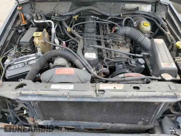 1999 Jeep Cherokee Sport with VIN 1J4FF68S9XL635836, listed as a Copart auction lot 59573195 with 187,035 mi miles and Salvage title. Bid and sale history available at DreamBid. Image 12.