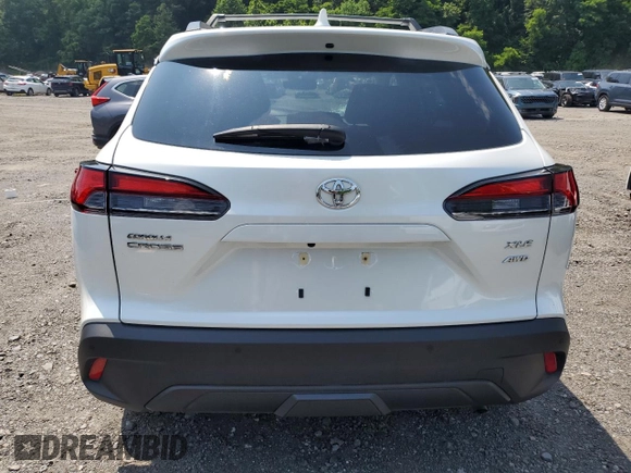 2023 Toyota Corolla Cross XLE with VIN 7MUDAABGXPV060797, listed as a Copart auction lot 62110665 with 18,293 mi miles and Salvage title. Bid and sale history available at DreamBid. Image 6.