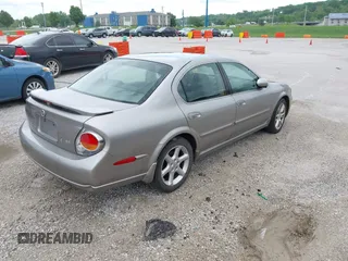 2002 Nissan Maxima GLE z VIN JN1DA31A12T000651, wystawiony jako IAAI lot #42167202 z przebiegiem Nie podano mil oraz . Historia ofert i sprzedaży dostępna na DreamBid. Obrazek 4.