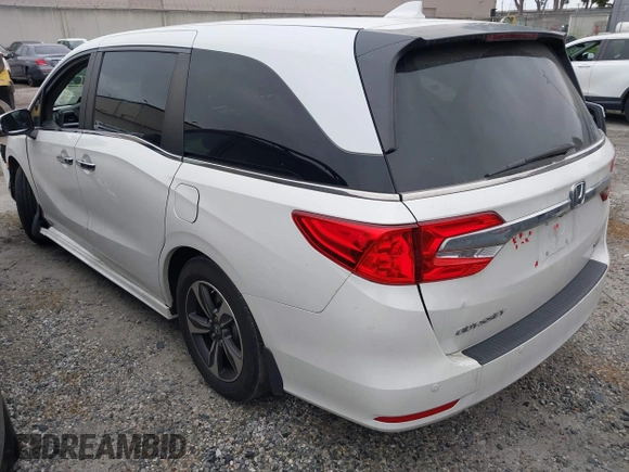 2020 Honda Odyssey Touring with VIN 5FNRL6H81LB028083, listed as a IAAI auction lot 42003810 with 71,536 mi miles and . Bid and sale history available at DreamBid. Image 3.
