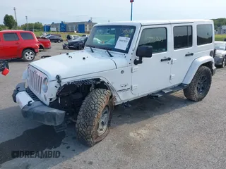 2016 Jeep Wrangler Unlimited Sahara z VIN 1C4HJWEG5GL172350, wystawiony jako IAAI lot #39987533 z przebiegiem 158 540 mil mil oraz . Historia ofert i sprzedaży dostępna na DreamBid. Obrazek 2.