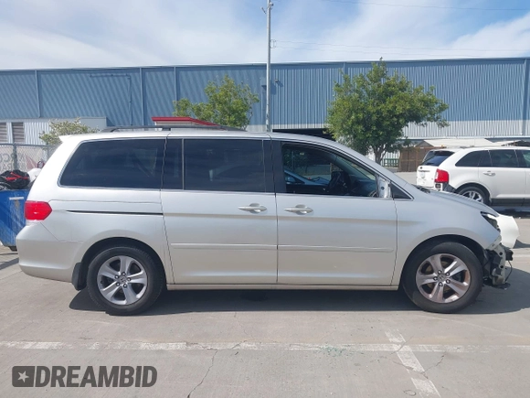 2009 Honda Odyssey Touring с VIN 5FNRL38969B013708, выставлен на аукционе IAAI как лот 42002538 с пробегом 198 220 миль миль и . История ставок и продаж доступна на DreamBid. Изображение 13.