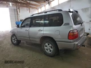 1999 Toyota Land Cruiser with VIN JT3HT05J1X0038590, listed as a Copart auction lot 87452404 with 232,244 mi miles and Salvage Title. Bid and sale history available at carsss.com. Image 2.