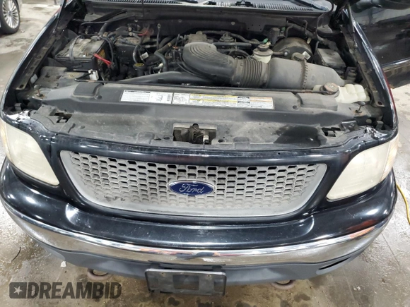 2000 Ford F-150 XL with VIN 1FTRX18L7YNA85909, listed as a Copart auction lot 56056165 with 134,765 mi miles and Salvage title. Bid and sale history available at DreamBid. Image 11.