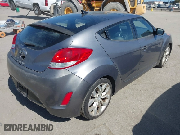 2013 Hyundai Veloster w/Black Int with VIN KMHTC6AD5DU095867, listed as a IAAI auction lot 42698380 with 115,528 mi miles and . Bid and sale history available at DreamBid. Image 4.