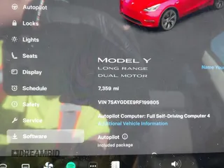 2024 Tesla Model Y Long Range with VIN 7SAYGDEE9RF199805, listed as a IAAI auction lot 42018221 with 7,359 mi miles. Bid and sale history available at carsss.com. Image 7.