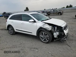 2017 Kia Niro Touring with VIN KNDCE3LC1H5094748, listed as a Copart auction lot 62934704 with 92,972 mi miles and Salvage Title. Bid and sale history available at carsss.com. Image 4.