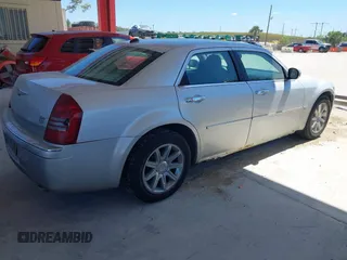 2005 Chrysler 300 with VIN 2C3AA63HX5H125777, listed as a IAAI auction lot 41843281 with 115,034 mi miles. Bid and sale history available at carsss.com. Image 4.