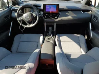 2025 Toyota Corolla Cross Hybrid S с VIN 7MUFBABG6SV077157, выставлен на аукционе Copart как лот 55625165 с пробегом 186 миль миль и Списание • Salvage title. История ставок и продаж доступна на DreamBid. Изображение 8.