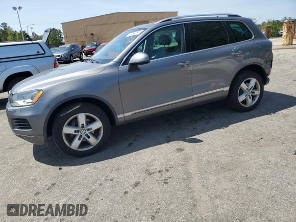 2012 Volkswagen Touareg Sport with VIN WVGEF9BP0CD010197, listed as a Copart auction lot 48480355 with 131,605 mi miles and Salvage Title. Bid and sale history available at DreamBid. Image 1.