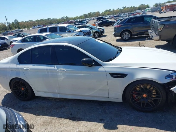 2013 BMW M5 with VIN WBSFV9C58DC772878, listed as a IAAI auction lot 41775691 with NaN miles. Bid and sale history available at carsss.com. Image 13.