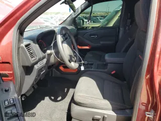 2023 Nissan Frontier PRO-4X with VIN 1N6ED1EK2PN618618, listed as a Copart auction lot 57197604 with 25,362 mi miles and Salvage Title. Bid and sale history available at carsss.com. Image 7.