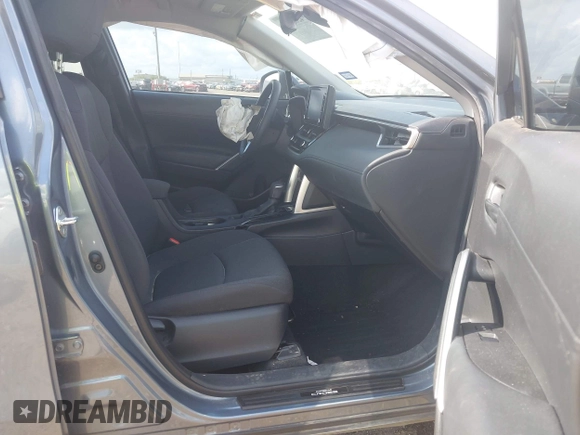 2022 Toyota Corolla Cross LE with VIN 7MUCAAAG0NV018245, listed as a IAAI auction lot 42039762 with 26,690 mi miles and . Bid and sale history available at DreamBid. Image 5.