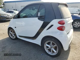 2014 Smart fortwo Pure with VIN WMEEJ3BA3EK780633, listed as a Copart auction lot 54009185 with 104,688 mi miles and Clean Title. Bid and sale history available at DreamBid. Image 2.