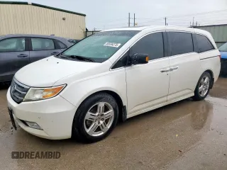 2012 Honda Odyssey Touring с VIN 5FNRL5H93CB131668, выставлен на аукционе Copart как лот 55536275 с пробегом 179 792 миль миль и Списание • Salvage title. История ставок и продаж доступна на DreamBid. Изображение 1.