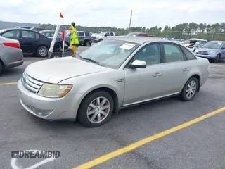 2008 Ford Taurus SEL with VIN 1FAHP24W88G178210, listed as a IAAI auction lot 41933552 with 142,971 mi miles. Bid and sale history available at carsss.com. Image 2.