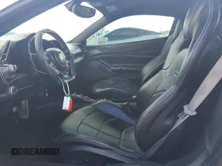 2016 Ferrari 488 z VIN ZFF79ALAXG0216223, wystawiony jako Copart lot #74210804 z przebiegiem Nie podano mil oraz Szkody całkowita. Historia ofert i sprzedaży dostępna na DreamBid. Obrazek 7.