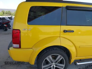 2011 Dodge Nitro z VIN 1D4PU6GX5BW512588, wystawiony jako IAAI lot #42471965 z przebiegiem 115 827 mil mil oraz . Historia ofert i sprzedaży dostępna na DreamBid. Obrazek 6.