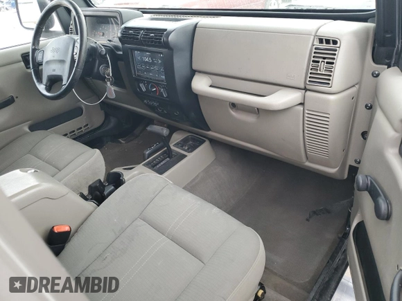 2004 Jeep Wrangler Sahara with VIN 1J4FA59SX4P713343, listed as a Copart auction lot 53608265 with 113,828 mi miles and Salvage title. Bid and sale history available at DreamBid. Image 8.