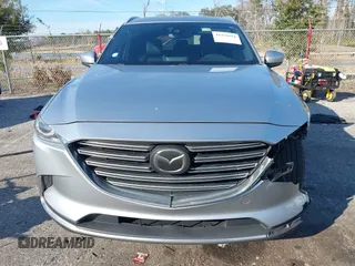 2017 Mazda CX-9 Grand Touring with VIN JM3TCADY5H0138176, listed as a IAAI auction lot 41458610 with 114,664 mi miles and . Bid and sale history available at DreamBid. Image 12.