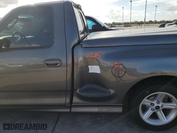 2003 Ford F-150 Lightning with VIN 2FTRF07303CA45572, listed as a Copart auction lot 74384694 with 0 mi miles and Salvage Title. Bid and sale history available at carsss.com. Image 12.