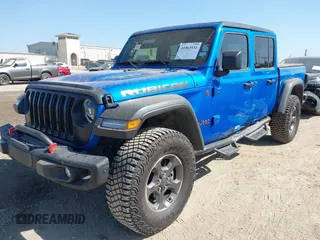 2023 Jeep Gladiator Rubicon with VIN 1C6JJTBG3PL581023, listed as a IAAI auction lot 41963931 with 15,023 mi miles and . Bid and sale history available at DreamBid. Image 18.