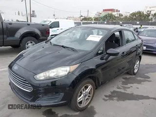 2017 Ford Fiesta SE z VIN 3FADP4BJ7HM145271, wystawiony jako IAAI lot #42056576 z przebiegiem 128 847 mil mil oraz . Historia ofert i sprzedaży dostępna na DreamBid. Obrazek 2.