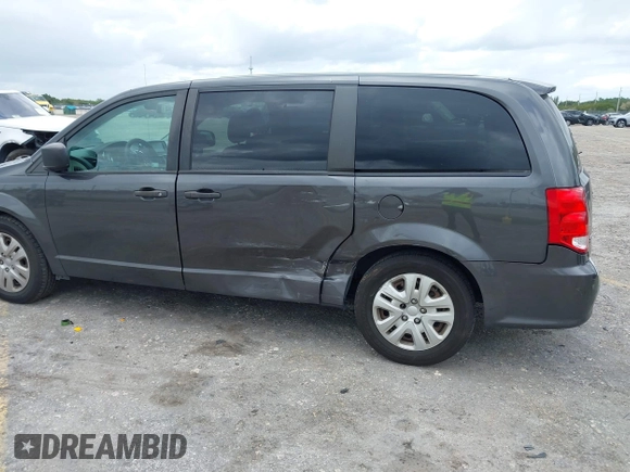 2019 Dodge Grand Caravan SE with VIN 2C4RDGBGXKR796974, listed as a IAAI auction lot 42008704 with 129,229 mi miles and . Bid and sale history available at DreamBid. Image 6.