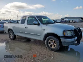 2000 Ford F-150 XL с VIN 1FTRX17L6YKB45245, выставлен на аукционе Copart как лот 62365195 с пробегом 306 210 миль миль и Списание • Salvage title. История ставок и продаж доступна на DreamBid. Изображение 4.