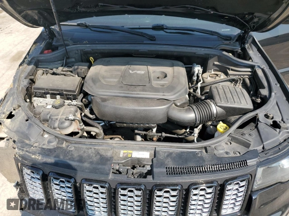 2018 Jeep Grand Cherokee Laredo E with VIN 1C4RJFAG9JC390597, listed as a Copart auction lot 71450474 with 69,645 mi miles and Salvage title. Bid and sale history available at DreamBid. Image 12.