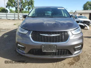 2023 Chrysler Pacifica Hybrid Touring L with VIN 2C4RC1L79PR608659, listed as a Copart auction lot 56945365 with 45,697 mi miles and Salvage title. Bid and sale history available at DreamBid. Image 5.