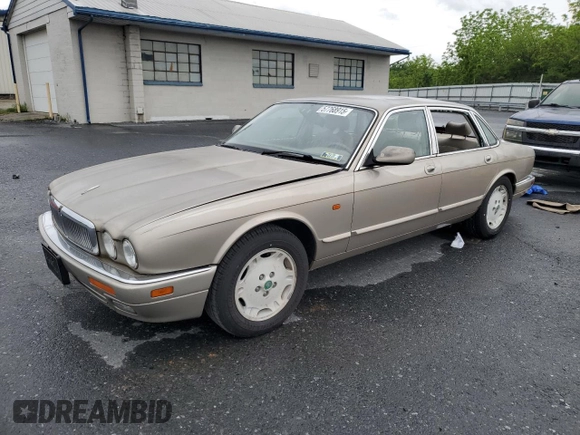 1995 Jaguar XJ with VIN SAJHX174XSC738856, listed as a Copart auction lot 57768915 with Not provided miles and Salvage title. Bid and sale history available at DreamBid. Image 1.