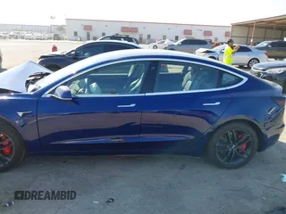 2018 Tesla Model 3 Long Range Battery with VIN 5YJ3E1EA6JF027065, listed as a IAAI auction lot 40532631 with 55,316 mi miles. Bid and sale history available at carsss.com. Image 15.