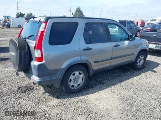 2006 Honda CR-V LX with VIN JHLRD68516C006561, listed as a IAAI auction lot 41855457 with 215,139 mi miles. Bid and sale history available at carsss.com. Image 4.