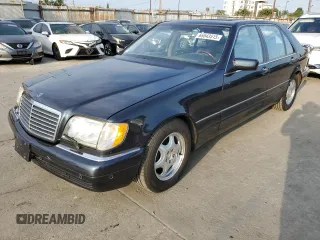 1999 Mercedes-Benz S with VIN WDBGA57G5XA428158, listed as a Copart auction lot 65543515 with 65,698 mi miles and Salvage title. Bid and sale history available at DreamBid. Image 1.
