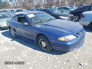 1996 Ford Mustang with VIN 1FALP4042TF140884, listed as a IAAI auction lot 41279611 with 233,047 mi miles. Bid and sale history available at carsss.com. Image 1.