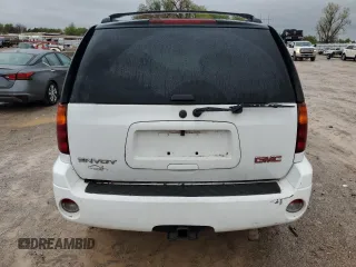 2006 GMC Envoy SLE z VIN 1GKDT13S562124794, wystawiony jako Copart lot #51649085 z przebiegiem 152 844 mil mil oraz Szkoda całkowita • Salvage title. Historia ofert i sprzedaży dostępna na DreamBid. Obrazek 6.