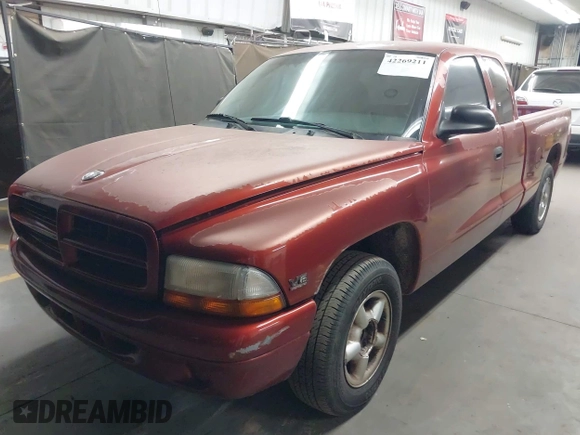 1999 Dodge Dakota SLT z VIN 1B7GL22XXXS240005, wystawiony jako IAAI lot #42269211 z przebiegiem 218 163 mil mil oraz . Historia ofert i sprzedaży dostępna na DreamBid. Obrazek 2.