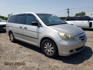 2007 Honda Odyssey LX with VIN 5FNRL38287B054504, listed as a Copart auction lot 59141665 with 128,617 mi miles and Salvage title. Bid and sale history available at DreamBid. Image 4.