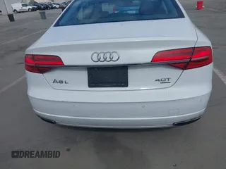 2016 Audi A8 Sport z VIN WAU43AFD3GN011061, wystawiony jako IAAI lot #42034532 z przebiegiem 109 877 mil mil oraz . Historia ofert i sprzedaży dostępna na DreamBid. Obrazek 16.
