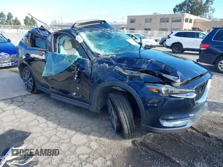 2018 Mazda CX-5 Grand Touring with VIN JM3KFBDM6J0439910, listed as a IAAI auction lot 41708816 with 120,492 mi miles and . Bid and sale history available at DreamBid. Image 1.