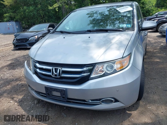 2014 Honda Odyssey Touring with VIN 5FNRL5H97EB054158, listed as a IAAI auction lot 42548360 with 91,161 mi miles and . Bid and sale history available at DreamBid. Image 12.
