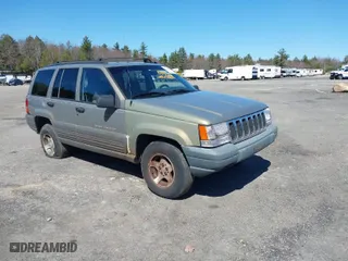 1997 Jeep Grand Cherokee Laredo with VIN 1J4GZ58S7VC713517, listed as a IAAI auction lot 42062214 with 205,533 mi miles. Bid and sale history available at carsss.com. Image 1.